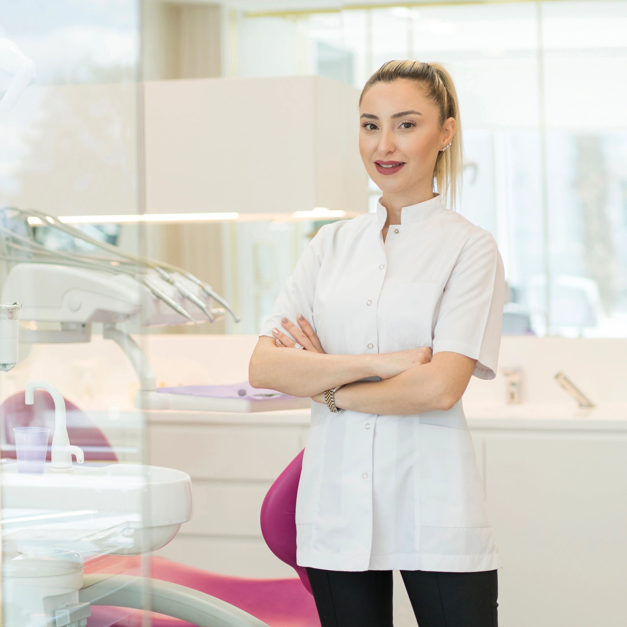 Portrait of a smiling female dentist in her office