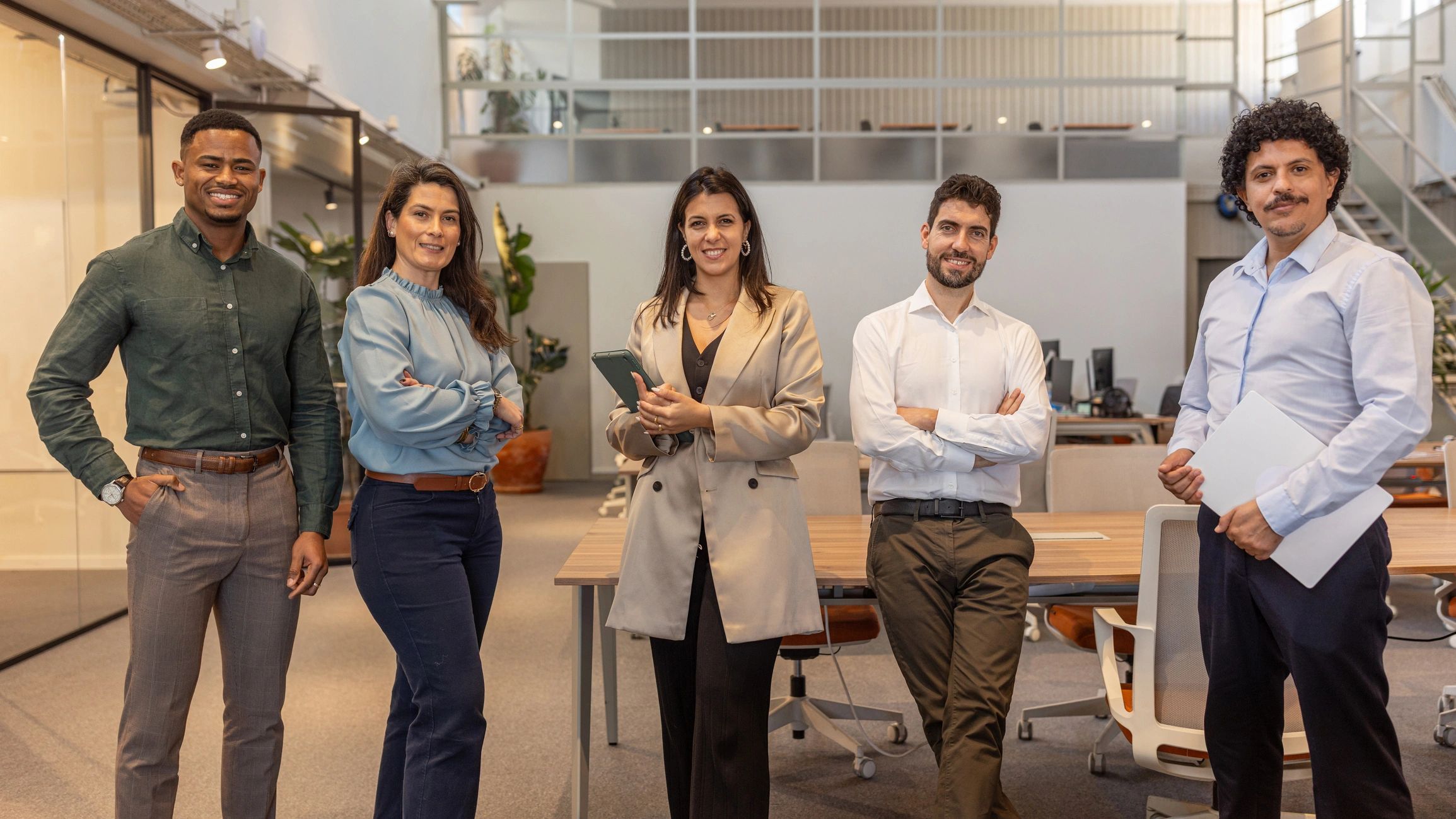 Professional team standing together in an office